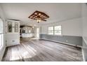 Bright living room featuring wood floors, a ceiling fan, and ample windows at 164 Daves Rd, York, SC 29745