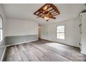 Open-concept living room featuring wood flooring and neutral-colored walls at 164 Daves Rd, York, SC 29745