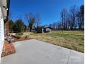 Expansive backyard featuring a concrete patio and a storage shed perfect for outdoor activities at 1730 Martin Rd, Kings Mountain, NC 28086