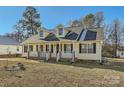 Inviting one-story home featuring a classic covered porch and well-maintained landscaping at 1852 Bon Rea Dr, Rock Hill, SC 29730