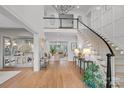 Spacious foyer with grand staircase, hardwood floors and decorative accents at 19117 Davidson Concord Rd, Davidson, NC 28036