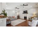 Inviting living room with hardwood floors, fireplace, and comfortable seating arrangement at 2508 Shaggy Bark Ct, Belmont, NC 28012