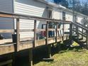 View of back deck with wooden railing, offering an outdoor space for relaxation at 5320 Golden Pond Dr, York, SC 29745