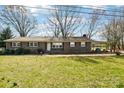 Classic brick ranch home featuring a carport, inviting curb appeal and cozy charm at 839 Oak Grove Rd, Kings Mountain, NC 28086