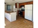 Spacious kitchen featuring light wood cabinets, island, and stainless steel appliances at 1151 Bowling Green Dr, Clover, SC 29710