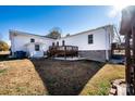 Expansive backyard featuring a wooden deck and a well-maintained lawn at 129 38Th St, Hickory, NC 28601