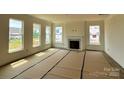 Bright living room features a fireplace and multiple windows with ample natural light at 1440 Ardmore Dr # 343, Sherrills Ford, NC 28673