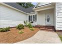 Inviting front porch with brick steps and landscaped flowerbeds enhances this home's curb appeal at 145 Mcbride Dr, Rockwell, NC 28138