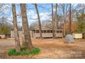 Exterior of home with screened porch at 153 Cheshire Ridge Rd, Harmony, NC 28634