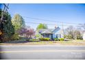 Charming home with a covered front porch and a well-maintained lawn at 209 W Church St, China Grove, NC 28023