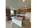 New kitchen featuring an island, wood cabinets, granite countertops, stainless steel appliances, and tile backsplash at 346 Knotty Wood Dr # 71, Monroe, NC 28110