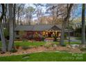 Charming exterior with mature trees, professional landscaping, and inviting front entrance at 4313 Kingswood Rd, Charlotte, NC 28226