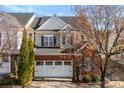 Charming exterior with brick facade, two-car garage and manicured landscaping at 12124 Red Rust Ln, Charlotte, NC 28277