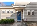 Charming front door with a wreath and well-maintained landscaping at 12124 Red Rust Ln, Charlotte, NC 28277