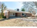 Classic brick home features a convenient carport and charming landscape, ready for move in at 126 Regal Cir # 2122, Mooresville, NC 28115