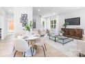 Elegant living and dining area featuring modern decor, comfortable seating, and lots of natural light at 2544 Pinestream Dr, Charlotte, NC 28216