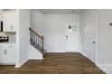 Bright foyer with hardwood floors, staircase and a white front door providing a warm welcome at 3044 Ora Smith Rd, Lincolnton, NC 28092