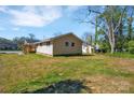 Landscaped yard surrounds a charming one story home, with many windows at 647 Black E St, Rock Hill, SC 29730