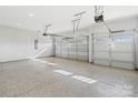 Spacious three-car garage with epoxy flooring and natural light at 1132 Meander Ln, Waxhaw, NC 28173