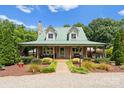 Well-maintained home with charming curb appeal, stone walkway, and a welcoming covered front porch at 1363 John Cline Ct, Lincolnton, NC 28092