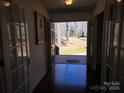 Foyer showcasing hardwood floors and a view of the front yard through the open door at 304 Taft St, Troy, NC 27371