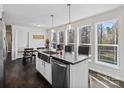 Bright kitchen featuring an island, stainless steel appliances, and a large window overlooking the yard at 33 Travora Cir, York, SC 29745