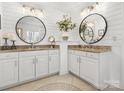 Beautiful bathroom featuring double sinks, granite countertops, and decorative mirrors at 604 Wisteria Walk Way, Fort Mill, SC 29715