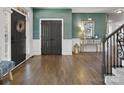 Elegant foyer with hardwood floors, a stylish console table, and beautiful wall decor at 604 Wisteria Walk Way, Fort Mill, SC 29715