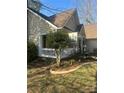 Welcoming front porch with decorative touches and a beautifully landscaped yard at 7144 Hunters Bluff Dr, Denver, NC 28037