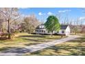 Inviting two-story home featuring a long driveway and well-maintained landscaping at 737 Sanside Dr, York, SC 29745