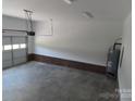 Spacious two car garage showcasing ample room for parking and storage at 122 Mason Tanner Ct # 5, Rock Hill, SC 29730