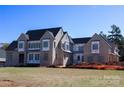 New construction home, awaiting completion, features a spacious design and a large front yard at 20310 Havenview Dr, Cornelius, NC 28031