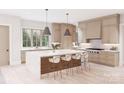 Bright kitchen with a large island, stylish seating, pendant lighting, and modern appliances at 20310 Havenview Dr, Cornelius, NC 28031