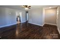 Inviting living room with hardwood floors and views into the newly updated kitchen at 211 W Roswell St, Troy, NC 27371