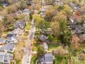 Suburban streetscape featuring well-maintained homes with lush green yards and mature trees at 2508 Bay St, Charlotte, NC 28205