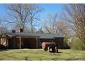 View of the backyard with open patio and space to add your own touches at 39058 Nc 740 Hwy, New London, NC 28127