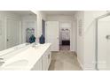 Bathroom with a double sink vanity, tile floor, and a glass-enclosed shower at 7882 Old Brook Rd, Sherrills Ford, NC 28673