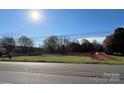 Cleared land with a large grassy area and some trees at 1554 Landis Hwy, Mooresville, NC 28115