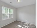 Bright bedroom with natural light, neutral walls, plush carpet and window with blinds at 1923 Caprington Dr, Fort Mill, SC 29707