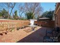 Paver patio with outdoor seating, planters and privacy fencing at 311 S Cedar St # C, Lincolnton, NC 28092