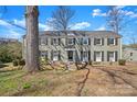 Charming two-story home with a brick facade, black shutters, and well-manicured landscaping at 343 Wakefield Dr # B, Charlotte, NC 28209
