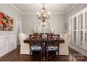Elegant dining room with a chandelier, stylish mirror, and seating for six at 4225 Jasmin May Dr, Charlotte, NC 28226