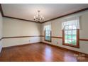 Spacious dining room with hardwood floors and a charming chandelier at 1008 High Wedge Rd, Shelby, NC 28152