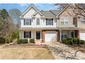 Attractive townhome with a well-kept lawn, complemented by vibrant flowers and mature landscaping at 1026 Eagles Nest Ln, Fort Mill, SC 29707
