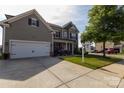 Beautiful home with a two-car garage and lovely landscaping for great curb appeal at 1501 Allegheny Way, Waxhaw, NC 28173