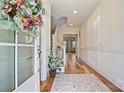 Inviting entryway with hardwood floors and staircase leading to the upper level at 15115 Rocky Bluff Loop, Davidson, NC 28036