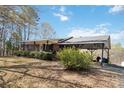 A beautiful view of the exterior and car port of this charming brick home with a well maintained lawn at 1923 Tracy Ct, Fort Mill, SC 29708