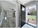 Inviting front entrance with a sleek black door, stylish hardware, and a well-lit foyer at 2301 Shamrock Dr, Charlotte, NC 28205