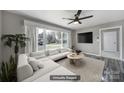 Staged living room featuring neutral paint, hardwood floors, large bay windows, ceiling fan, and new furniture at 2301 Shamrock Dr, Charlotte, NC 28205