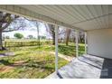 Relaxing covered front porch that offers ample space with views of the picturesque surrounding landscape at 260 Penninger Dr, Woodleaf, NC 27054